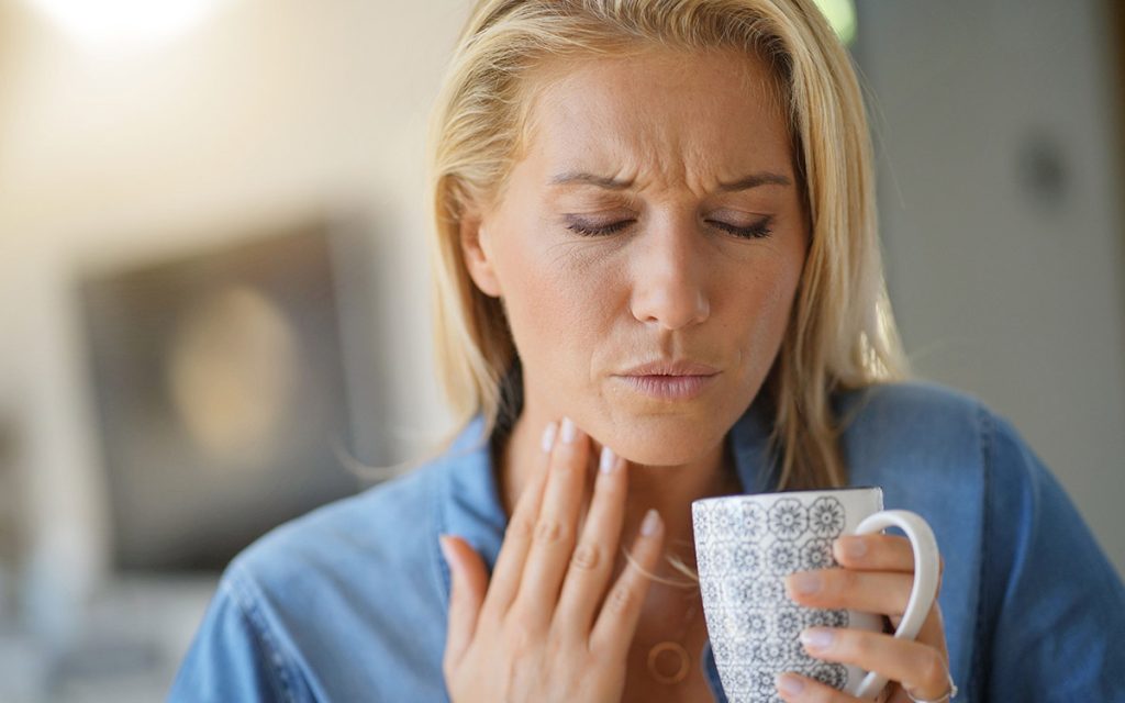 woman with sore throat