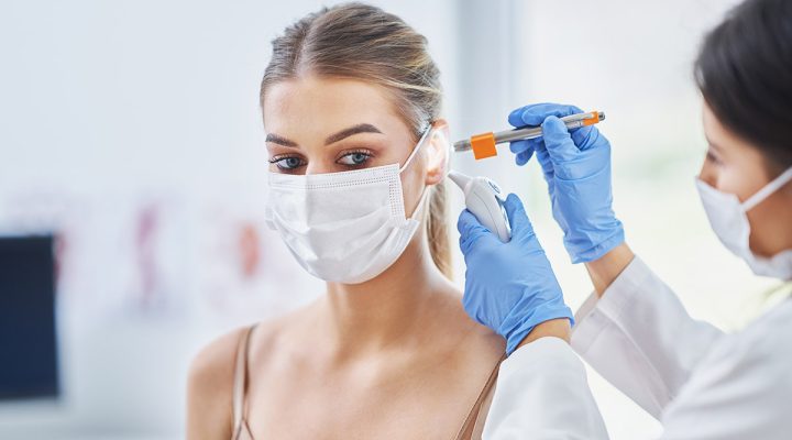 ENT specialist checking up on her female patient