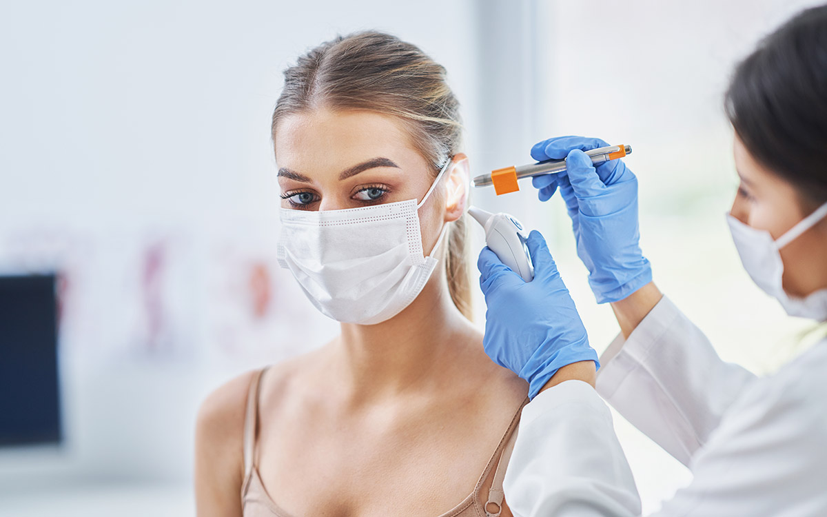 ENT specialist checking up on her female patient