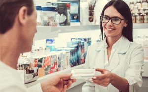 client getting medicine at the pharmacy