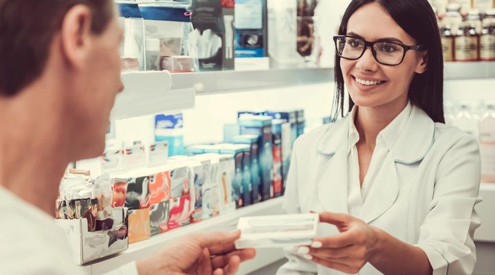 client getting medicine at the pharmacy