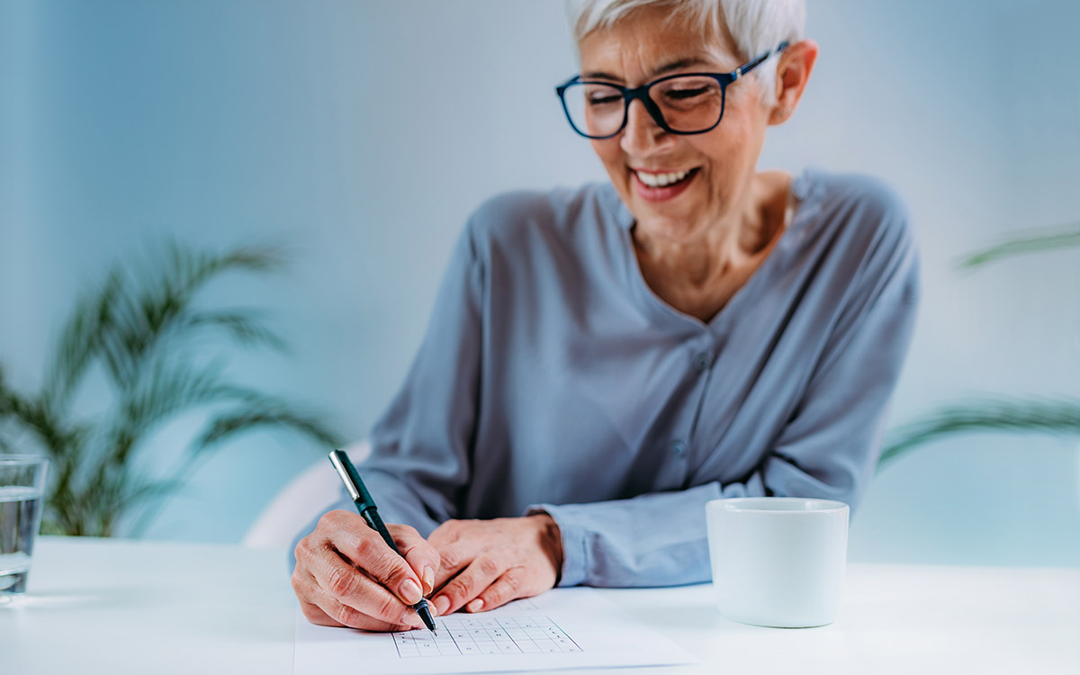 woman doing some notes on a paper