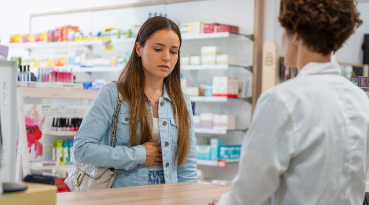 woman with pain at the pharmacy