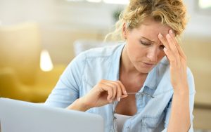 woman at work with fatigue