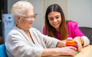 woman playing with senior a game