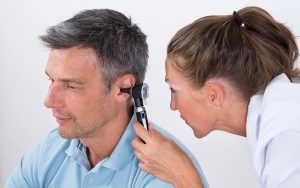 Doctor Examining Patient's Ear