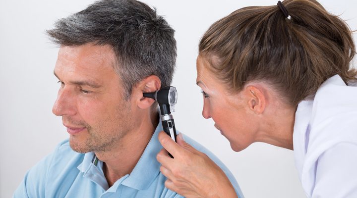 Doctor Examining Patient's Ear