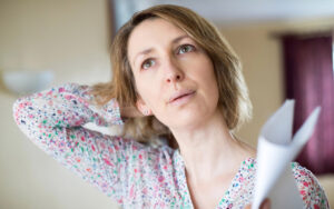 Mature Woman Experiencing Hot Flush From Menopause