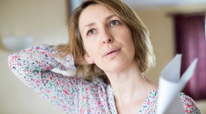 Mature Woman Experiencing Hot Flush From Menopause