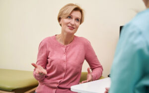 woman talking to her doctor at the clinic