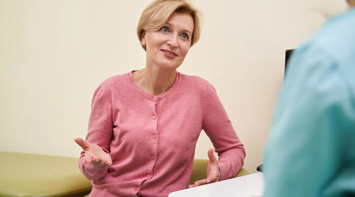 woman talking to her doctor at the clinic