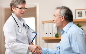 doctor shaking hand with patient