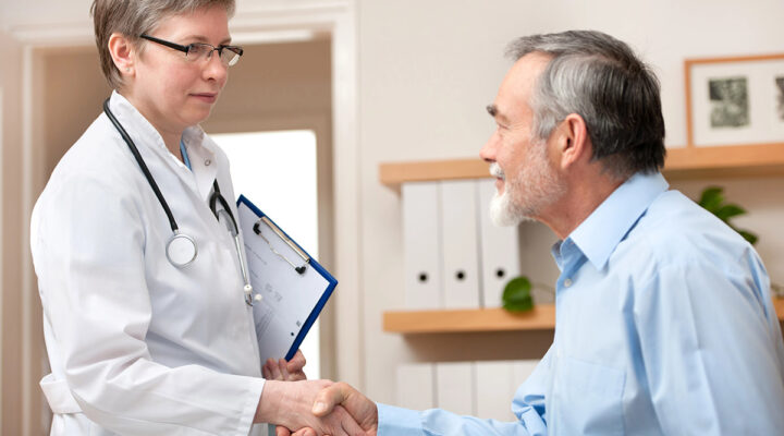 doctor shaking hand with patient