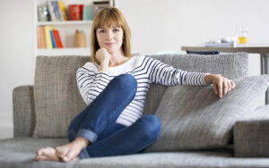 woman sitting at home happy