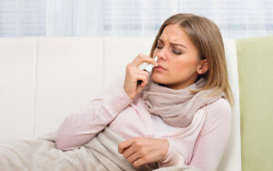 woman using a compounded nasal spray