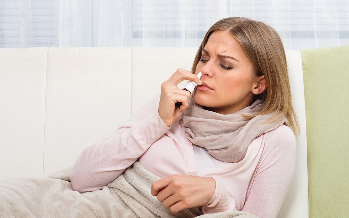 woman using a compounded nasal spray